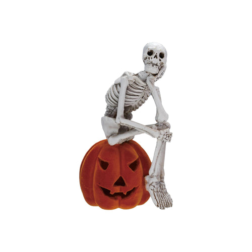 Skeleton Sitting on Pumpkin