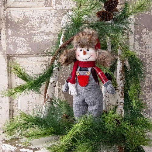 Snowman Standing in Overalls